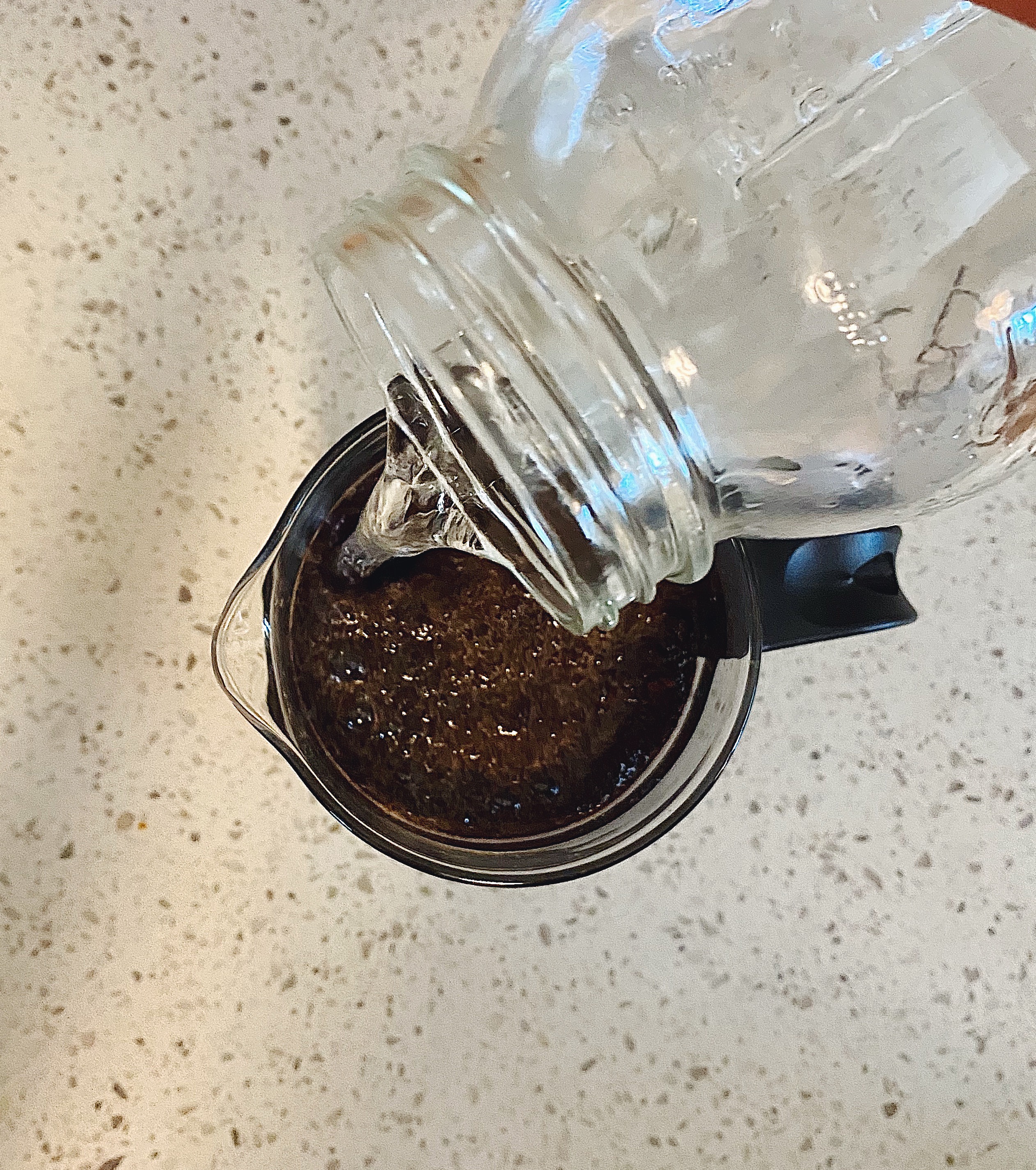 Slowly Pour Water over cold brew filter.
